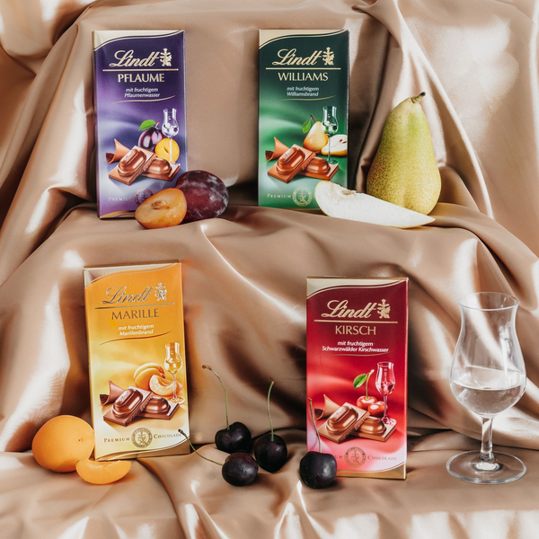 Молочный шоколад с абрикосовым ликером Lindt Marille Premium Chocolate 100г 7843 фото