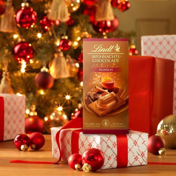 Молочний шоколад із ромовим пуншем Lindt Weihnachts-Chocolade Rum-Punsch 100г 7844 фото