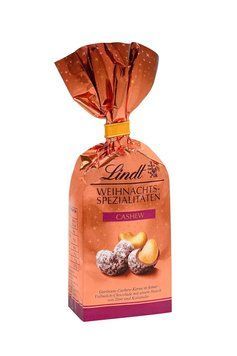 Шоколадні цукерки Lindt Weihnachts Spezialitaten Cashew 100г 10569 фото