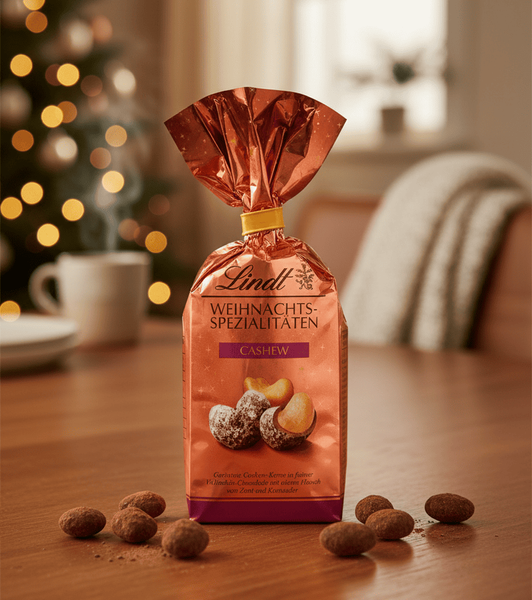 Шоколадні цукерки Lindt Weihnachts Spezialitaten Cashew 100г 10569 фото