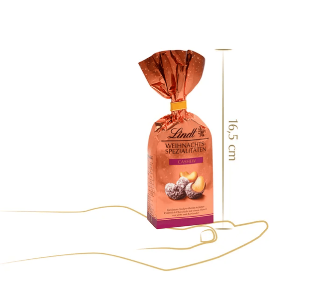 Шоколадні цукерки Lindt Weihnachts Spezialitaten Cashew 100г 10569 фото