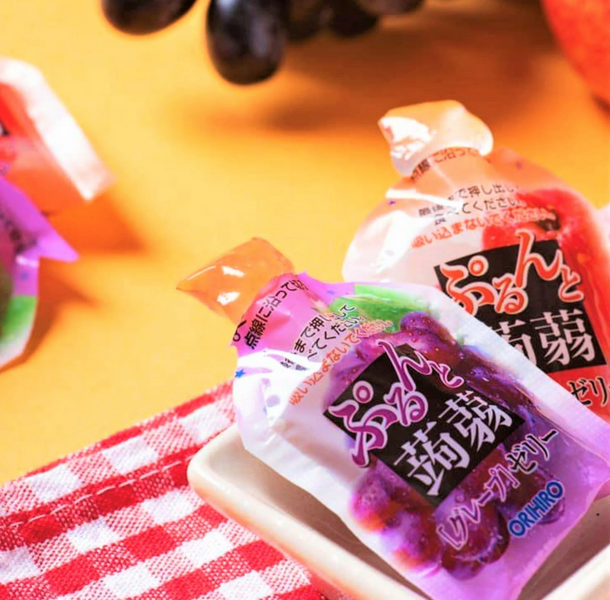 Японская конфета жидкое желе Orihiro Purunto Konnyaku Jelly Pouch Apple Grape 12шт 8031 фото