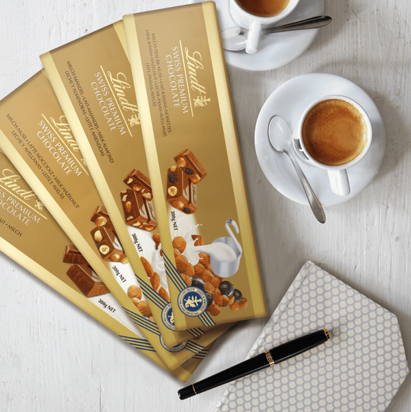 Шоколад Lindt Hazelnut and Raisin Gold Milk Chocolate 300г 9986 фото