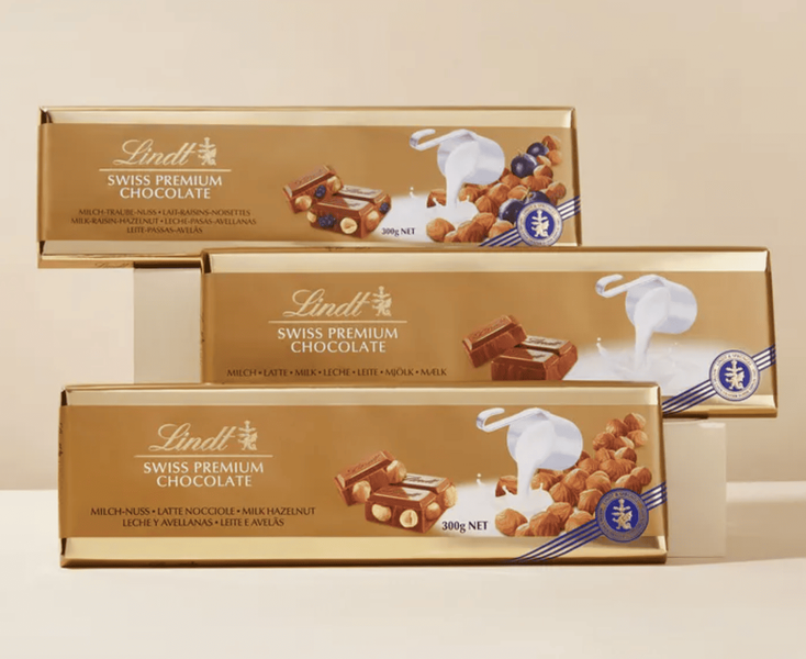 Шоколад Lindt Hazelnut and Raisin Gold Milk Chocolate 300г 9986 фото