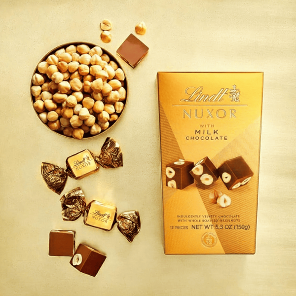 Шоколадні цукерки Lindt Nuxor Milk Chocolate 150г 9898 фото