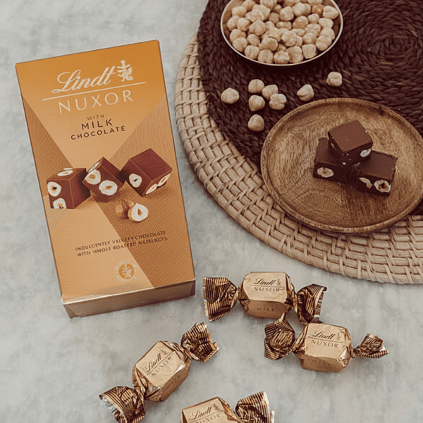 Шоколадні цукерки Lindt Nuxor Milk Chocolate 150г 9898 фото