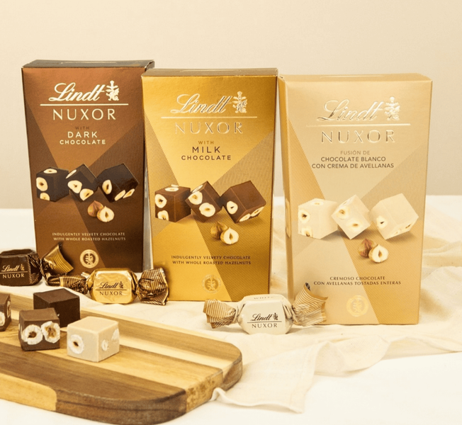 Шоколадні цукерки Lindt Nuxor Milk Chocolate 150г 9898 фото